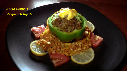 green pepper stuffed with curried lentils on a nest of cinnamon spiced cabbage